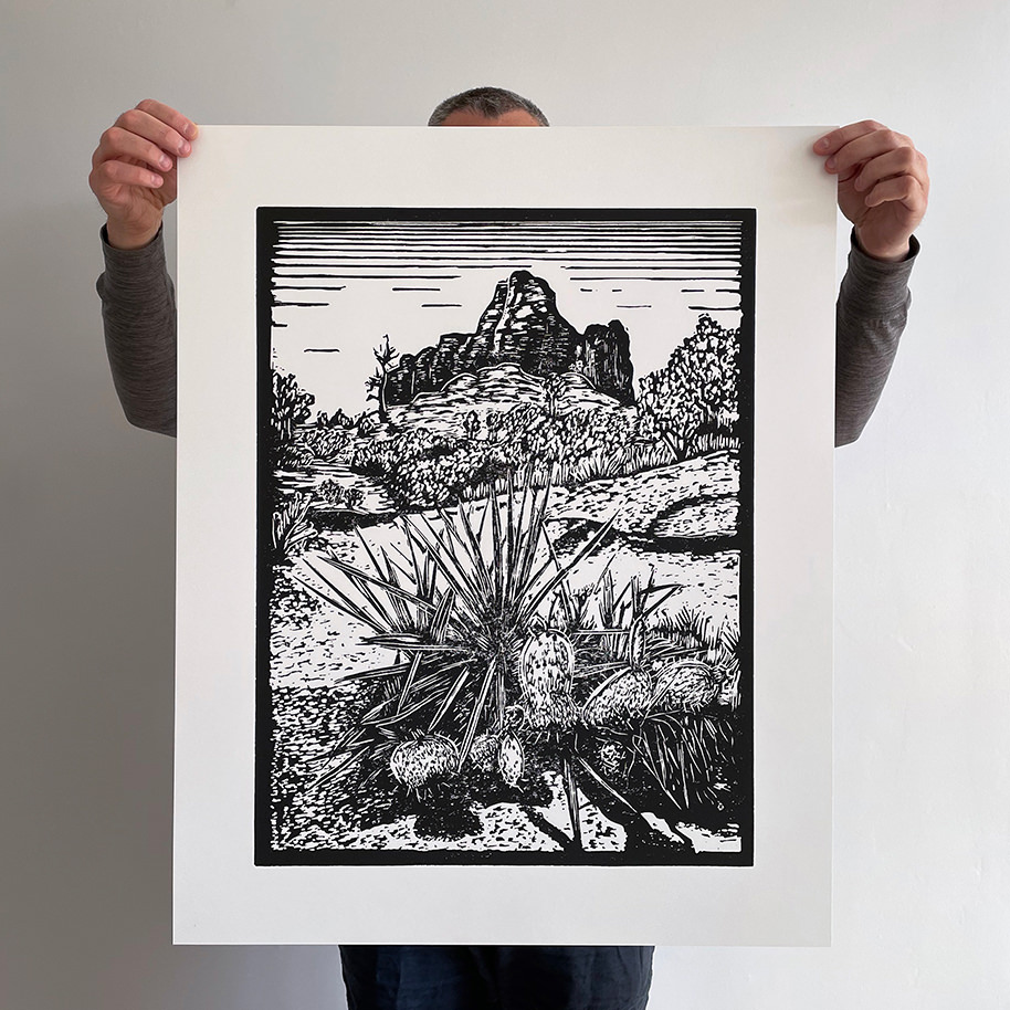 Kevin Allan holding large giclee print of Bell Rock, Sedona